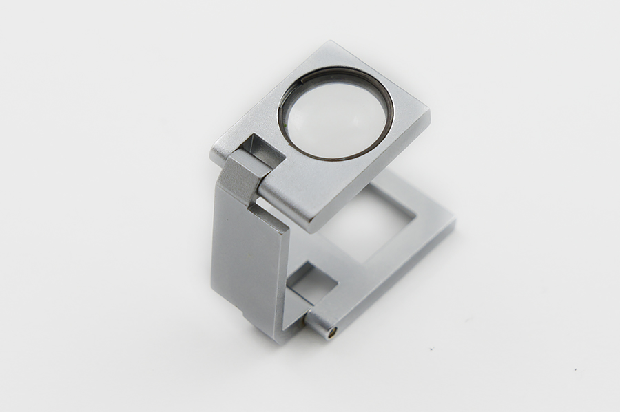 Збільшуване скло для контролю якості (12-кратне) TEXTILIA 10х10 мм